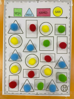 In the "Cheerful Oaks" class, geometric shapes are colored according to codes.